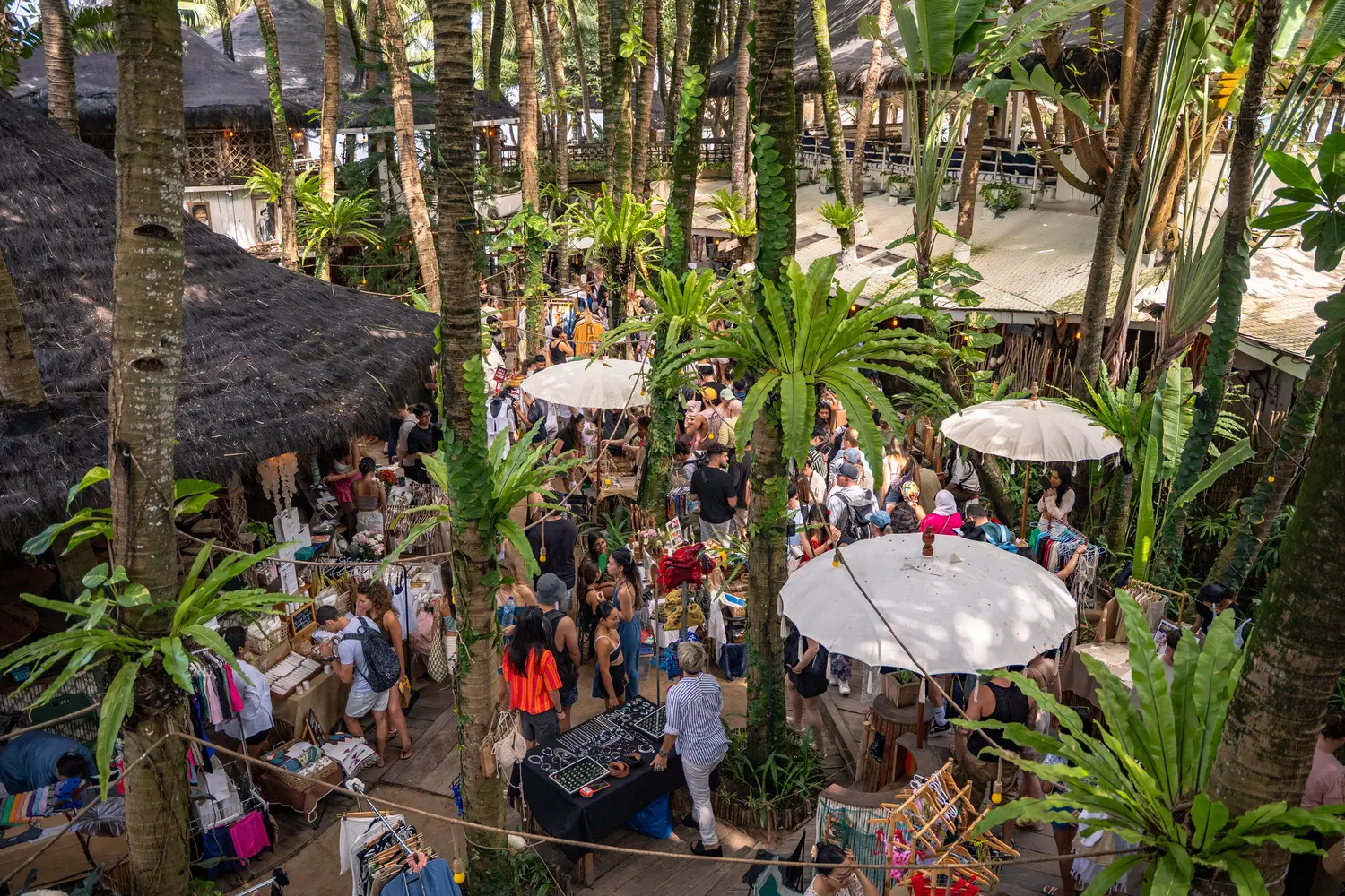 Visitors browsing local stalls at La Brisa’s Sunday Market